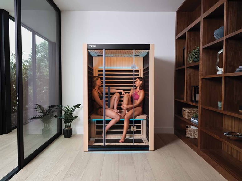 Two people sitting in a Kiruna 2 infrared sauna