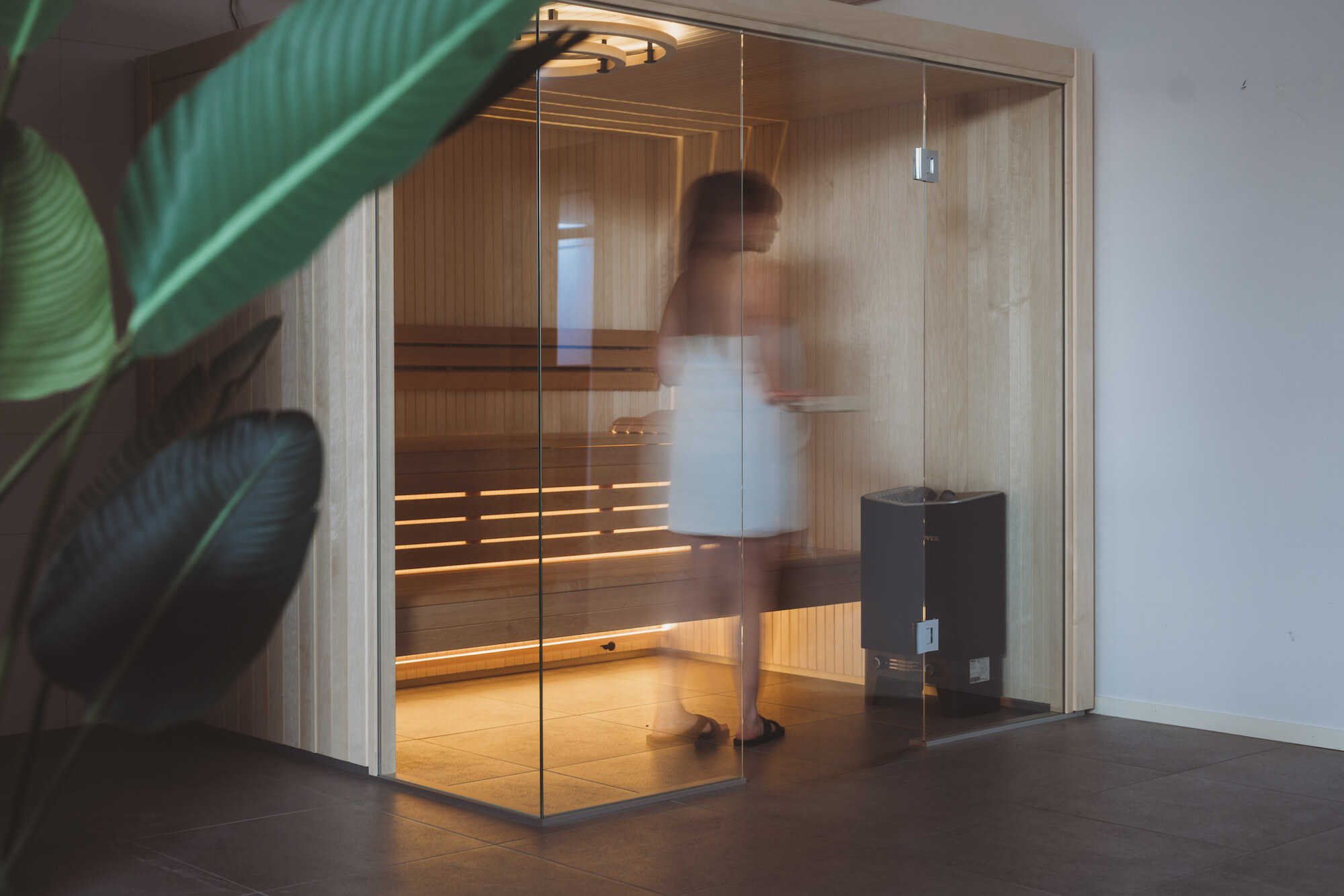 Woman in a Harmony sauna room Woman in a Harmony sauna room